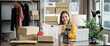 © Yingyaipumi - Young asian female selling clothes online by mobile phone live streaming.business women begin with small SME with online sales was happy with the ordered and on table are a lots of boxes ready to ship