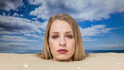 Wall Mural - Woman buried in sand on beach