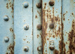 Painted rusty background with metal rivets