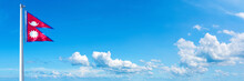 Nepal Flag Waving On A Blue Sky In Beautiful Clouds - Horizontal Banner