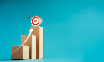 Poster - shining rise up arrow shoot up towards the goal, 3d target icon on the top of wooden cube blocks, ba
