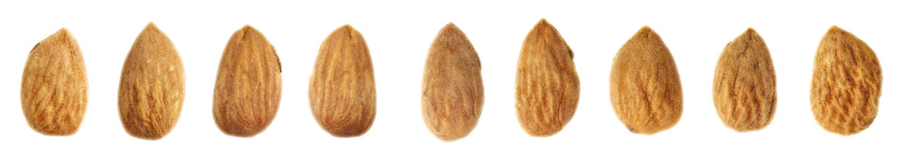 Wall Mural - Close up picture of almonds isolated on white background, selective focus.