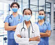 © Mumtaaz Dharsey/peopleimages.com - Team of medical doctors, covid hospital healthcare response and cardiology staff diversity. Corona virus disease clinic, young professional nurse and proud expert surgeon in protection face mask