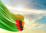Fototapeta  - Zambia national flag cloth fabric waving on the sky - Image