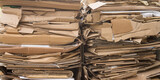 Fototapeta Kwiaty - Two packages made of recyclable brown cardboard ready for transport to the paper mill
