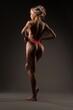 © Wisky - Cheerful muscular woman in rose tango show perfect spine