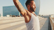 © Andrii Nekrasov - Close up, young bearded male athlete doing workout, stretching on the embankment
