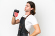 © luismolinero - Butcher handsome man wearing an apron and serving fresh cut meat isolated on white background suffering from backache for having made an effort
