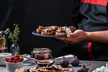 Wall Mural - Set Bruschettas with figs and goat cheese, Blue cheese and nuts, onion jam, fresh thyme, honey on grilled crusty bread, tasty appetizer wine, banner, catering menu recipe