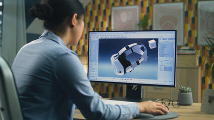 Poster - Female freelancer working from home office and creating 3D prototype of modern VR headset in professional 3D modeling software using pc