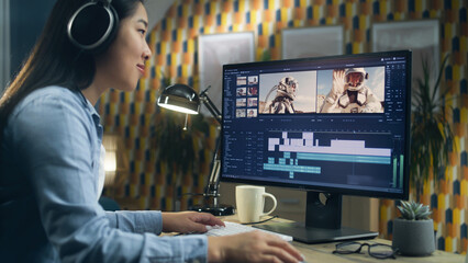 Poster - Asian woman in headset editing video with astronauts for client in program on personal computer while working at the table from home office. Freelance