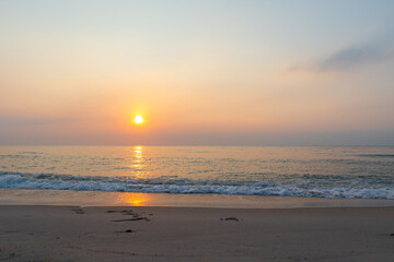 Summer time background with sun rises on the beach.