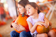 © Andy Dean - Adorable Little Girls Holding Pumpkins At A Pumpkin Patch