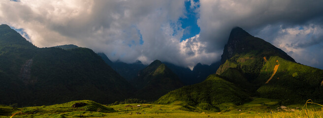 Banner Beautiful landscape mountain green field grass meadow white cloud blue sky on sunny day. panoramic Majestic green scenery big mountain hill cloudscape valley panorama view greenery countryside