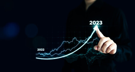 Wall Mural - Businessman pointing arrow graph corporate future growth plan. Business development to success and growing growth year 2022 to 2023 concept