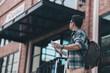 © Charnchai saeheng - Tourists hold maps to find attractions, restaurants or hotels while waiting for their bus or passenger boat and the background is a big city.  backpackers and travel concept..