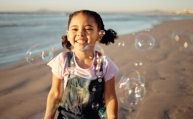 Canvas Print - Beach, bubbles and a girl playing at sunset, having fun and enjoying an ocean trip. Freedom, energy and child running alone the sea, excited and playful while chasing bubble and laughing in nature