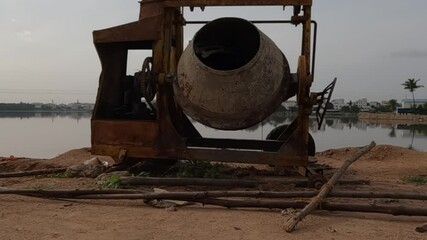 Canvas Print - Machine used to mix cement and sand material to prepare concrete