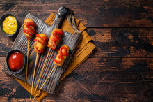 Mini Deep Fried Corn Dogs With Mustard And Ketchup On Wooden Board. Wooden Background. Top View. Copy Space