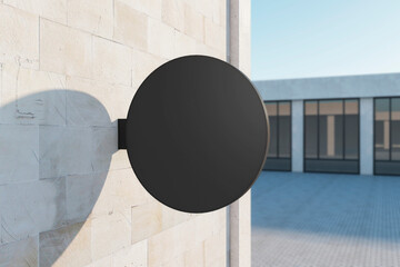 Wall Mural - Empty round black stopper on concrete building. Bright city with sunlight background. Ad, pub, cafe, or restaurant banner. Mock up, 3D Rendering.