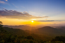 Beautiful  Landscape Sunset Over Peak Mountain With Warm Light Mae Moh  Lampang, Thailand.