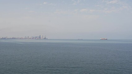 Wall Mural - Cargo ships at sea in Batumi carry cargo. Transport, logistics, business.