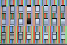 Rows Of Windows Of Colorful Striped Building