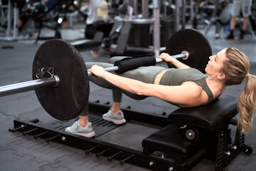 Caucasian woman making workout at the gym