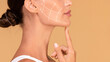 © Prostock-studio - Lady touching chin, lifting arrows showing facial anti-aging treatment on skin, panorama, free space