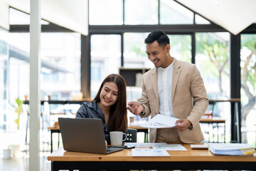 Asian business adviser meeting to analyze and discuss the situation on the financial report in the meeting room.Investment Consultant, Financial advisor and accounting concept