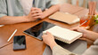 © bongkarn - Professional female math tutor teaching and tutoring a male college student. cropped image