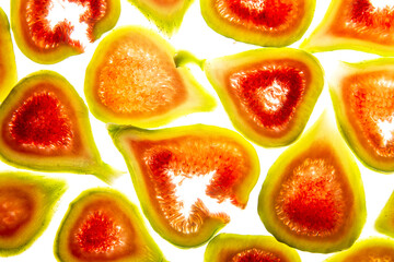 Wall Mural - slices of sweet fresh figs on a white background - food background