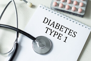 Wall Mural - types 1 Diabetes. text on white paper in notebook near stethoscope