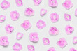 © olgaarkhipenko - Pink hydrangea flowers on light gray background flat lay top view. Floral pattern. Decorative gentle background with pink flowers inflorescences. Romantic spring card