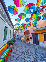 Wall Mural - Walk down the street under the colored umbrellas, Szentendre, Hungary