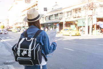 backpacker journey destination concept, young tourism student traveling city tour at market street i