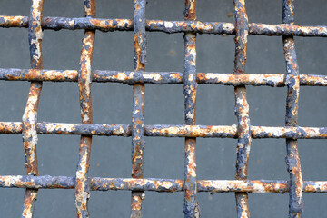 Poster - old rusty grille on the windows