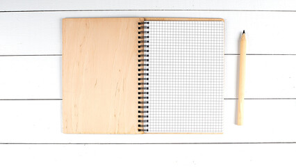 Poster - Blank open notebook with pen on white wooden desk