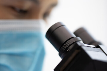 Wall Mural - professional research scientist using microscope in science chemistry laboratory, medical technology