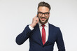 happy businessman with glasses talking on the phone and smiling
