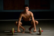 © Ben Gingell - Nineteen year old teen boy exercising with a barbell shirtless