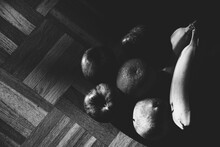 Still Life With Organic Apples, Pear, Orange Banana Ripe Fruits On Vintage Wooden Surface. Healthy Eating Background. Black White Photography