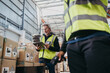 © Jacob Lund - Warehouse manager using a digital tablet