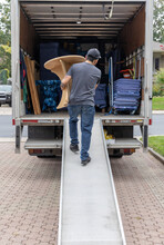 Professional Mover Carrying Furniture