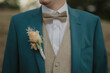 © Alina Schessler - groom in suit with bow