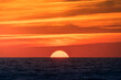 © ADDICTIVE STOCK - Bright sun setting above dark sea