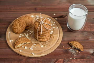 Wall Mural - homemade oatmeal cookies on a wooden tray with burlap in a rustic style. the view from the top, flatlay. The concept of a home bakery, proper and healthy nutrition. Copy space for text