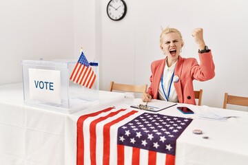 Sticker - Beautiful caucasian woman working at political campaign angry and mad raising fist frustrated and furious while shouting with anger. rage and aggressive concept.