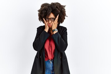 Wall Mural - African american woman with afro hair wearing business jacket and glasses tired hands covering face, depression and sadness, upset and irritated for problem