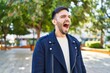 © Krakenimages.com - Young hispanic man screaming at park